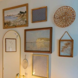 a wall with a mirror and decor