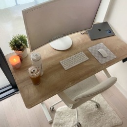 a desk with a computer and a chair