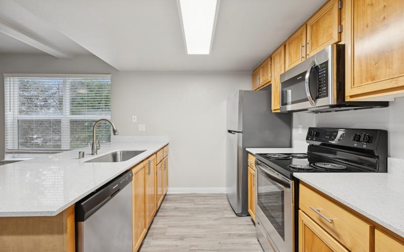 a kitchen with stainless steel appliances